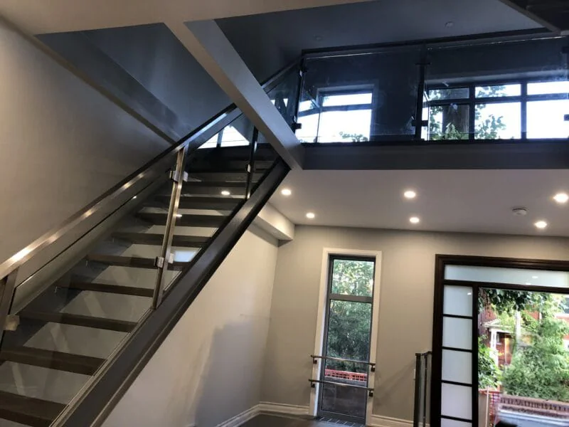 Modern double stringer stairs with glass railings