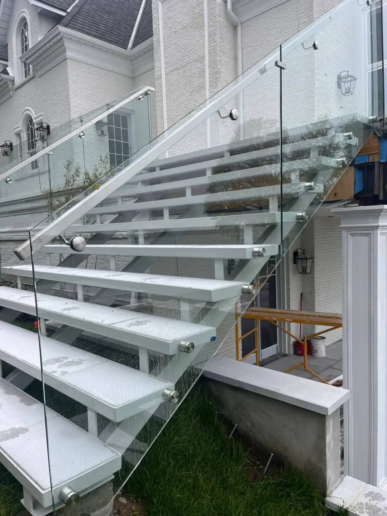 Outdoor steel staircase installation with durable metal steps and safety railings for exterior building access.