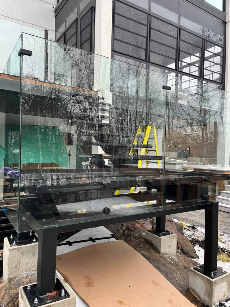 Steel staircase with glass balustrade system